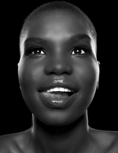 black and white photo of  beautiful African American girl with short hiar smiling 